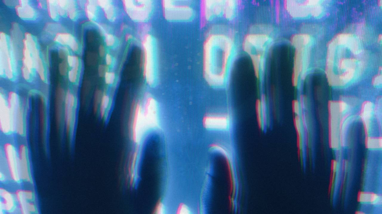Hands on computer screen, glitch. Photo Credit: Andre Moura (Pexels, adapted)
